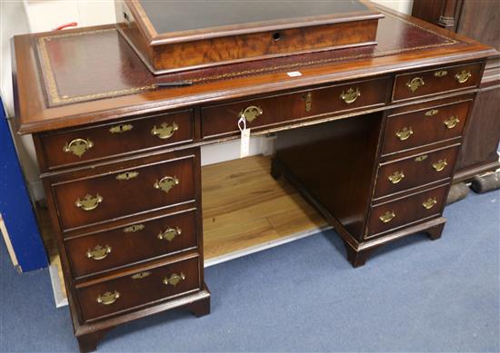 A Georgian style mahogany pedestal desk, W.137cm